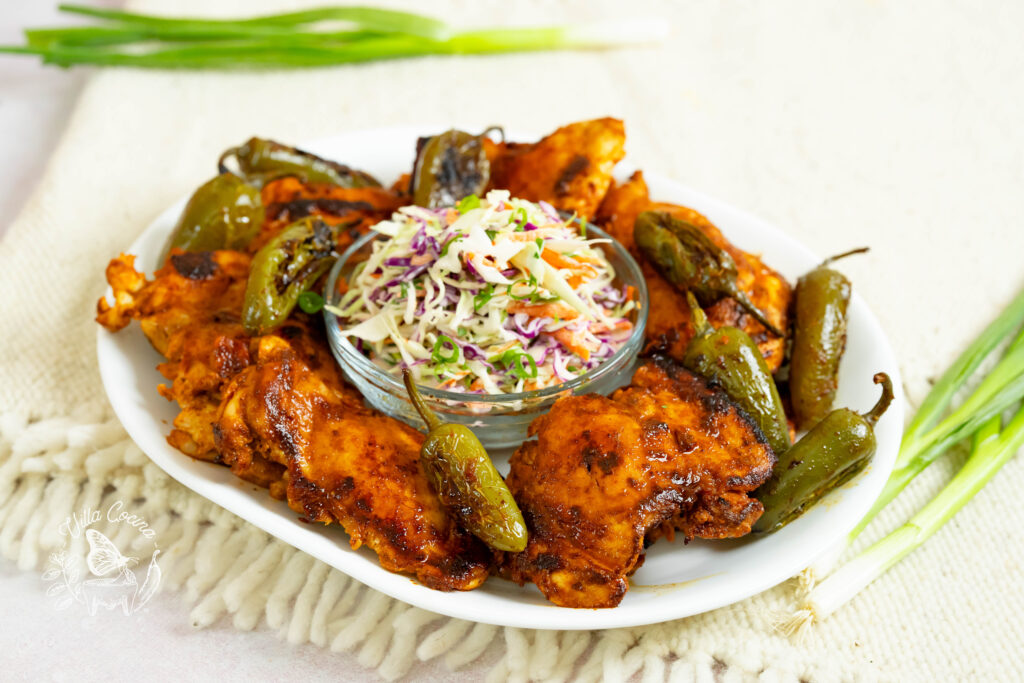 Pan-seared chicken marinated with jalapeño juice and spices along with coleslaw.